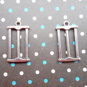 SALE--20pcs of Antique Silver saw pendant charm Size:25mmx13mm
