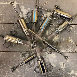 vintage hypodermic plungers
