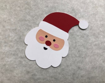 10 troqueles de cabezas de Papá Noel en capas, impresos en cartulina de alta calidad, ideales para álbumes de recortes navideños, creación de tarjetas, decoraciones y otras manualidades con papel.