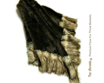 May include: A brown faux fur throw blanket with a lighter brown trim. The blanket is folded and draped over a white surface. Fur Accents® Premium Faux Fur Throw Blankets.