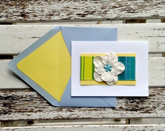 Yellow and blue striped printed ribbon with white flower preppy note card with coordinating lined envelope. Set of 10 cards and envelopes.