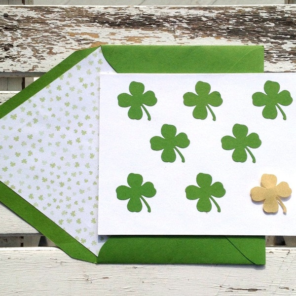 Paper punched Kelly green and gold 4 leaf clovers on a white note card with shamrock lined envelope.  Set of 10 cards + lined envelopes.