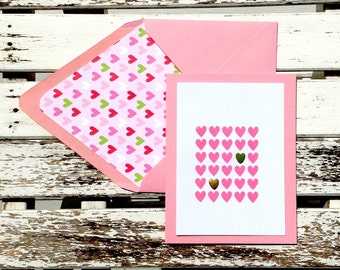 Small pink hearts stamped, embossed & embellished on white and pale pink card with coordinating lined envelope. Set of 10 cards + envelopes.