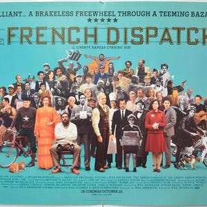 May include: A movie poster for "The French Dispatch" against a teal background. The title is in large, illuminated letters above a crowd of diverse characters. Text at the top reads "Brilliant... A Brakeless Freewheel Through a Teeming Bazaar."