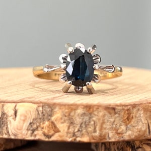 Gold sapphire ring. A vintage 18K yellow gold and platinum blue sapphire ring. image 1