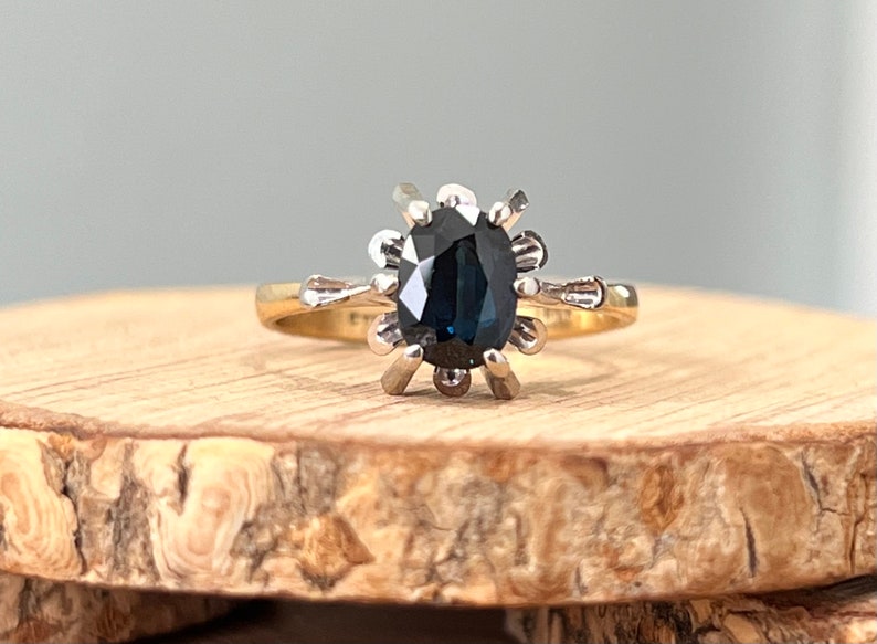 Gold sapphire ring. A vintage 18K yellow gold and platinum blue sapphire ring. image 1