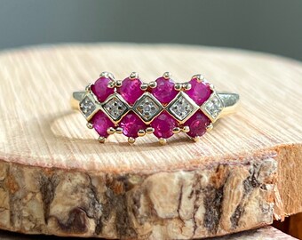 Gold ruby ring. A 9K yellow gold ring, with natural rubies and diamonds in a geometric setting.