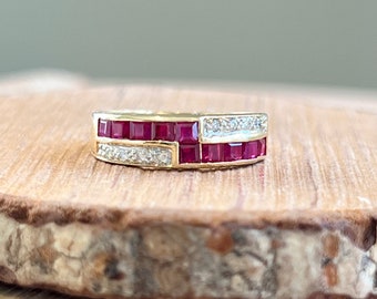 Gold ruby ring. A small petite 18K yellow gold ring, with square cut rubies and pavé set diamonds in a geometric setting.