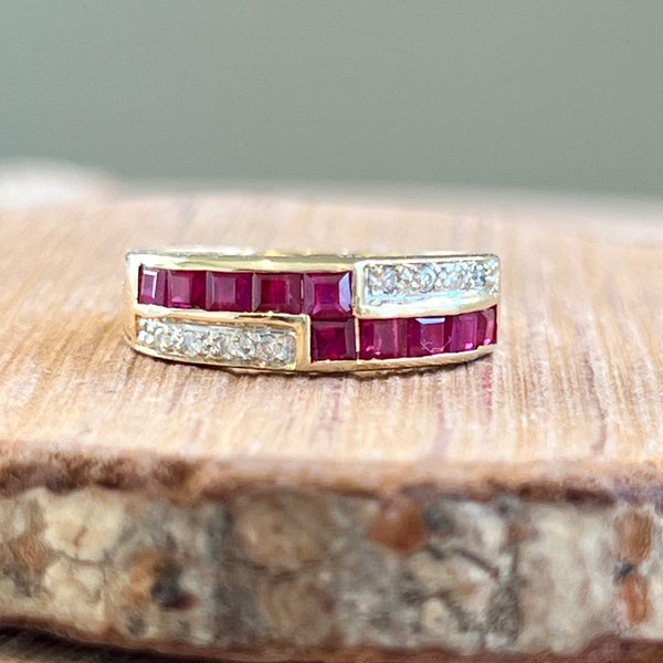 Gold ruby ring. A small petite 18K yellow gold ring, with square cut rubies and pavé set diamonds in a geometric setting.