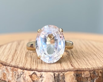 Gold sapphire ring. A large 10 carat natural white sapphire, claw set as a solitaire 9K yellow gold ring.