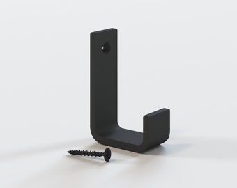 Gancho de pared de acero negro mate: moderno gancho para abrigos y toallas de estilo rústico.