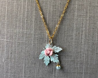 Pastel blue maple leaf necklace on gold tone chain