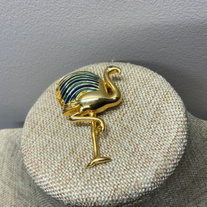 Blue and green enamel flamingo brooch in gold tone metal