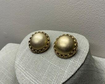 Textured domed filigree clip on earrings signed Whiting and Davis in gold tone