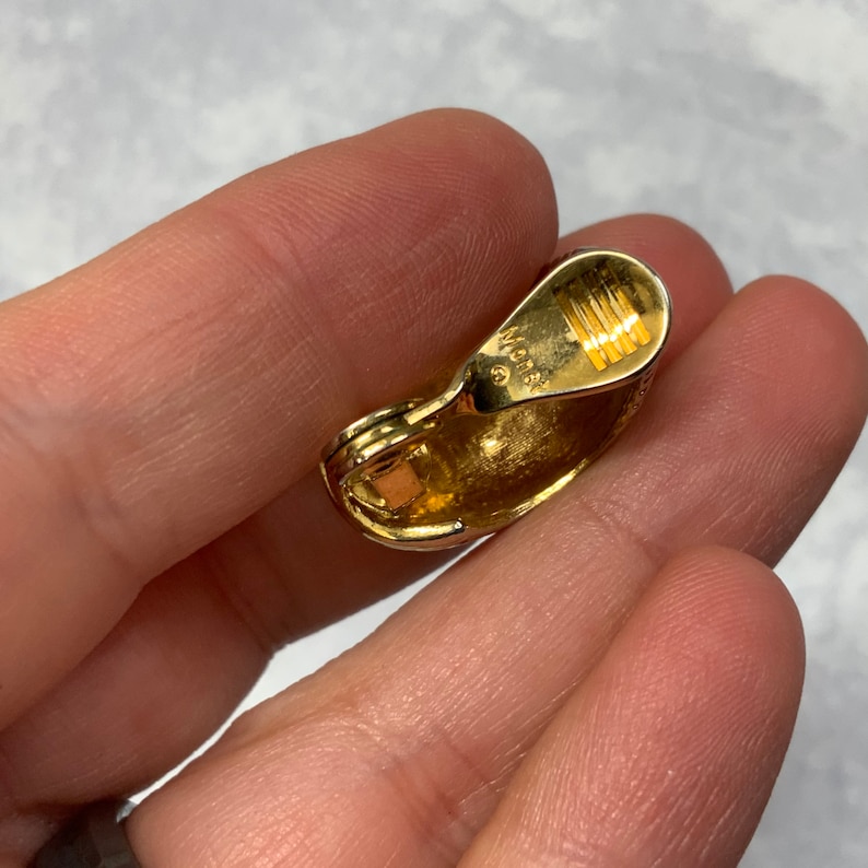 Monet ribbed shrimp style hoop clip on earrings in gold tone metal