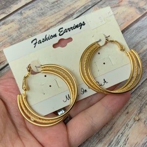 Textured layered pierced lever back hoops in gold tone metal