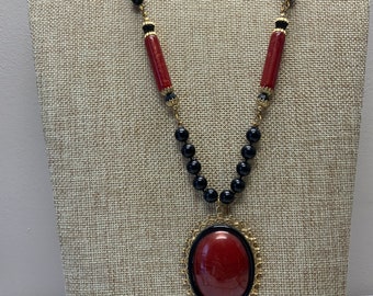 Vintage 1980s orange and black acrylic beaded cabochon necklace