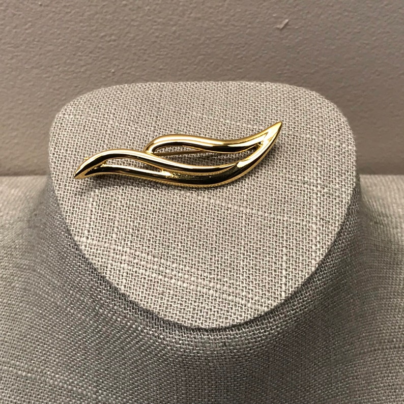 Swirling gold tone Monet bar brooch