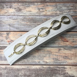 Light gold tone chunky oval link embossed bracelet