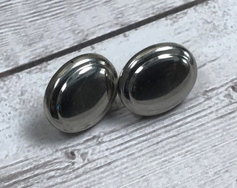 Polished silver tone graduated hollow oval post earrings