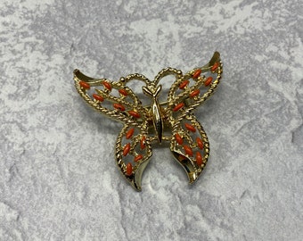 Vintage dipped gold tone filigree butterfly brooch signed gerrys with orange accents