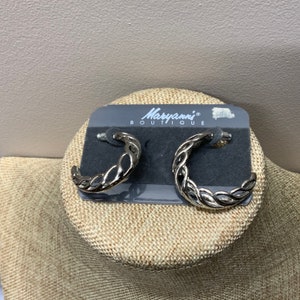 Large woven silver tone pierced hoop earrings