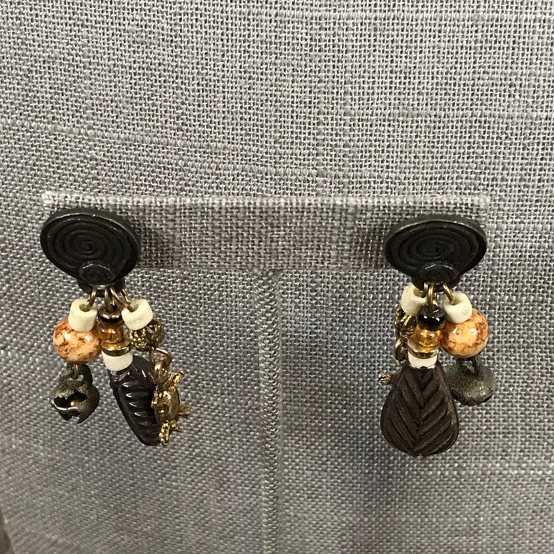 Vintage 1980s tribal pierced dangle earrings with turtle charms