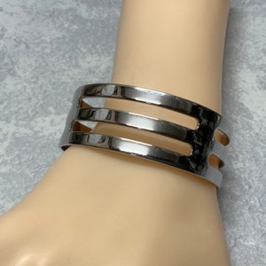 Vintage Sarah Coventry silver tone striped fenestrated cuff bracelet