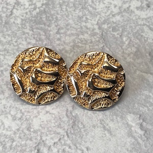 Avon Circular crinkle clip on earrings in gold tone metal