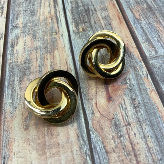 Pierced chunky gold interlocking knot earrings - image 1