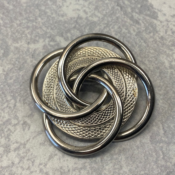 Swirling interlocking loop joint brooch in silver… - image 1