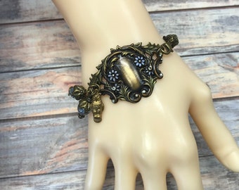 Art nouveau style antique brass floral bracelet