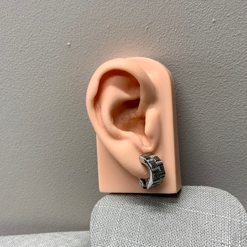 Silver tone basket weave half hoop clip on earrings