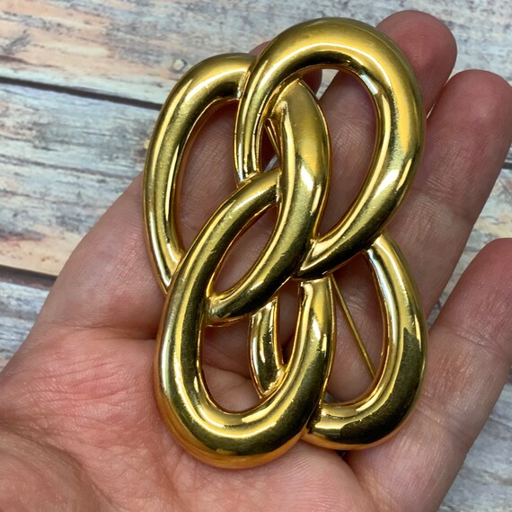 Large gold tone interlocking ovals brooch Gem