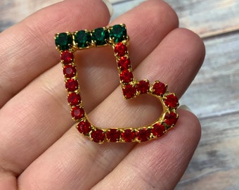 Vintage rhinestone holiday Christmas stocking brooch in gold tone metal