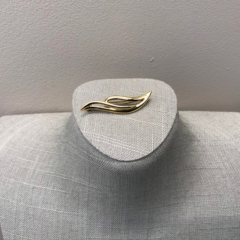 Swirling gold tone Monet bar brooch