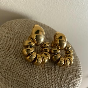Signed MONET beaded clip on hoop door knocker style earrings in gold