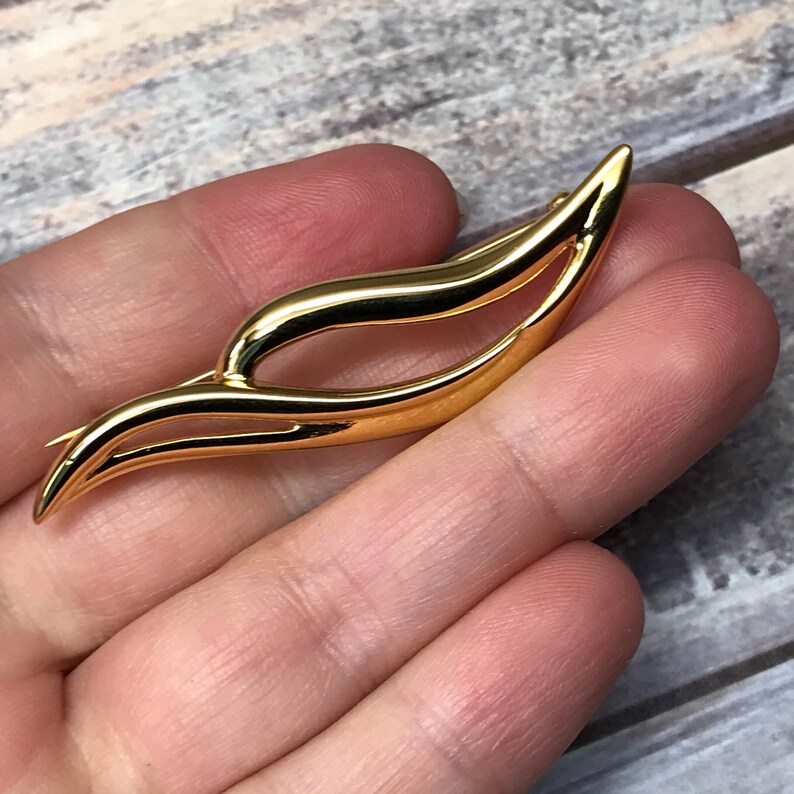 Swirling gold tone Monet bar brooch