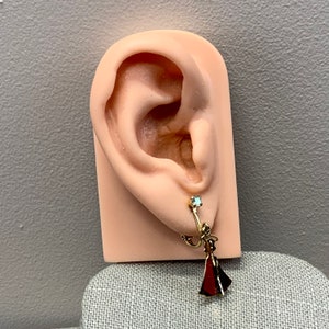 Avon gold tone angel clip on earrings