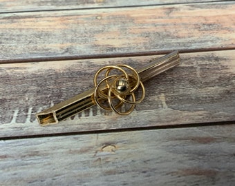 Vintage gold tone 1970s wire flower knot bar brooch