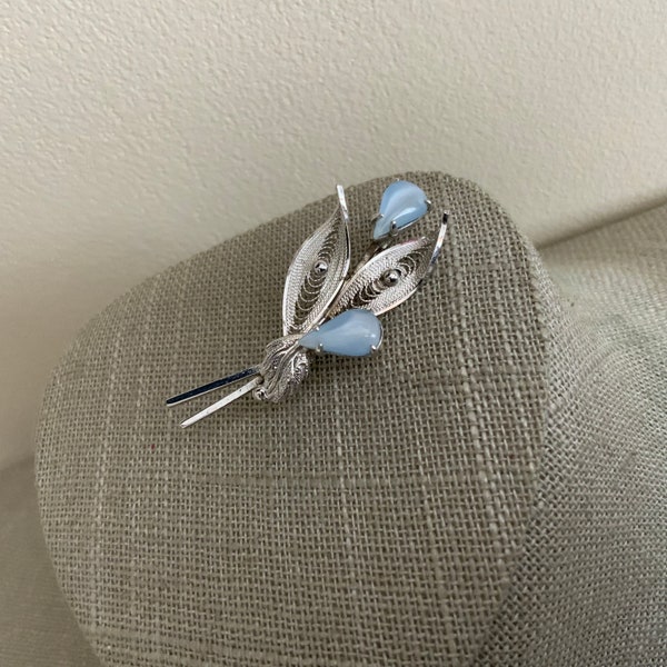 Signed Dixelle Sterling silver pale blue rhinestone floral cannetile brooch