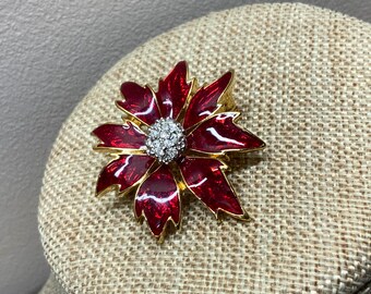 Vintage gold tone red enamel poinsettia brooch with rhinestones