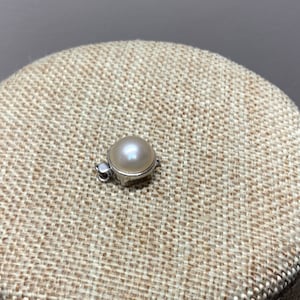 Vintage marked 925 insertion clasp with faux pearl cabochon