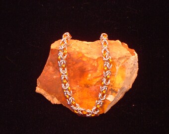 orange and silver chainmaille bracelet
