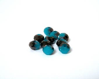 Glass beads, faceted, blue color with black coating, 8 x 6 mm by 10