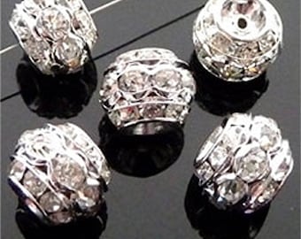Perles métal argenté et strass forme rondelles, 10x8 mm vendues par
