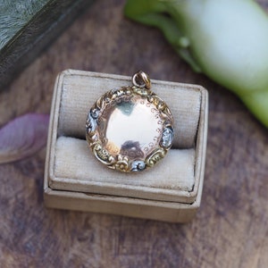 Antique Victorian Two Tone 10k Gold Round Locket with Scroll and Floral Engraving