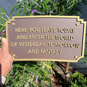 Here You Leave Today and Enter the World Park Entrance Sign