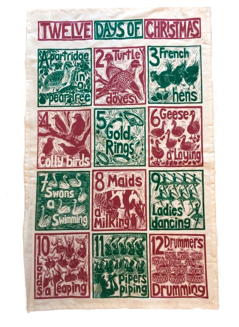 May include: A vintage-style tea towel with a red and green illustration of the Twelve Days of Christmas. The illustration features a different image for each day, such as a partridge in a pear tree, two turtle doves, and three French hens.