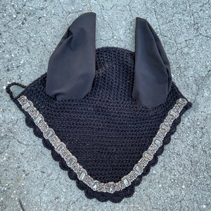 May include: Black crochet horse fly mask with silver beaded trim and black ear covers.
